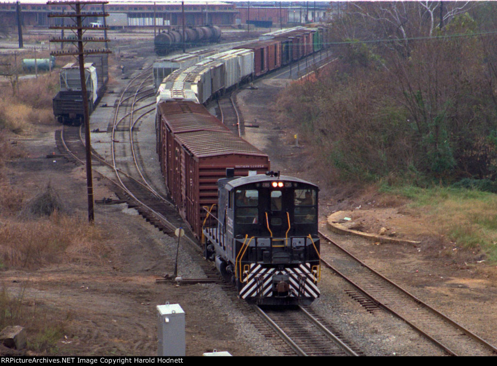 NS 2305 pulls a long string of cars